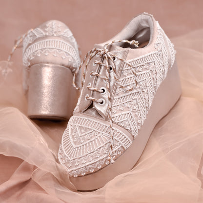 White wedding sneakers for bride with ornate handwork