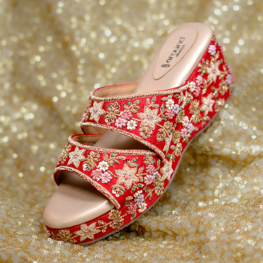 Bridal wedge sandals adorned with floral embroidery and delicate beadwork.