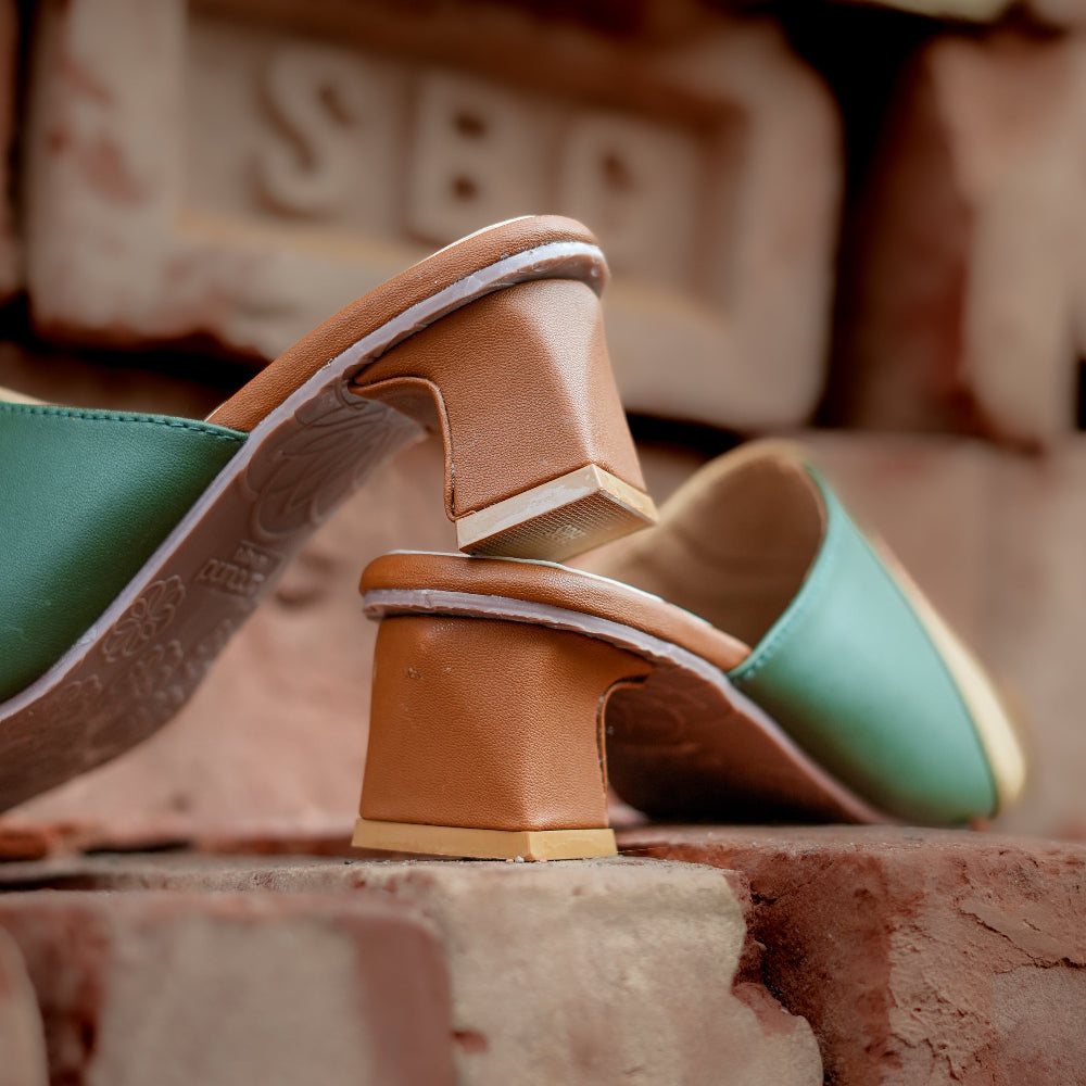 Contemporary heeled mules with curved panel detailing in green and brown tones