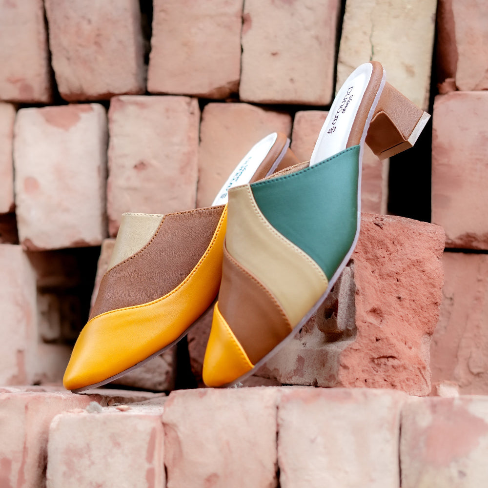 Pointed-toe mule in earthy colour blocks with sculpted block heel