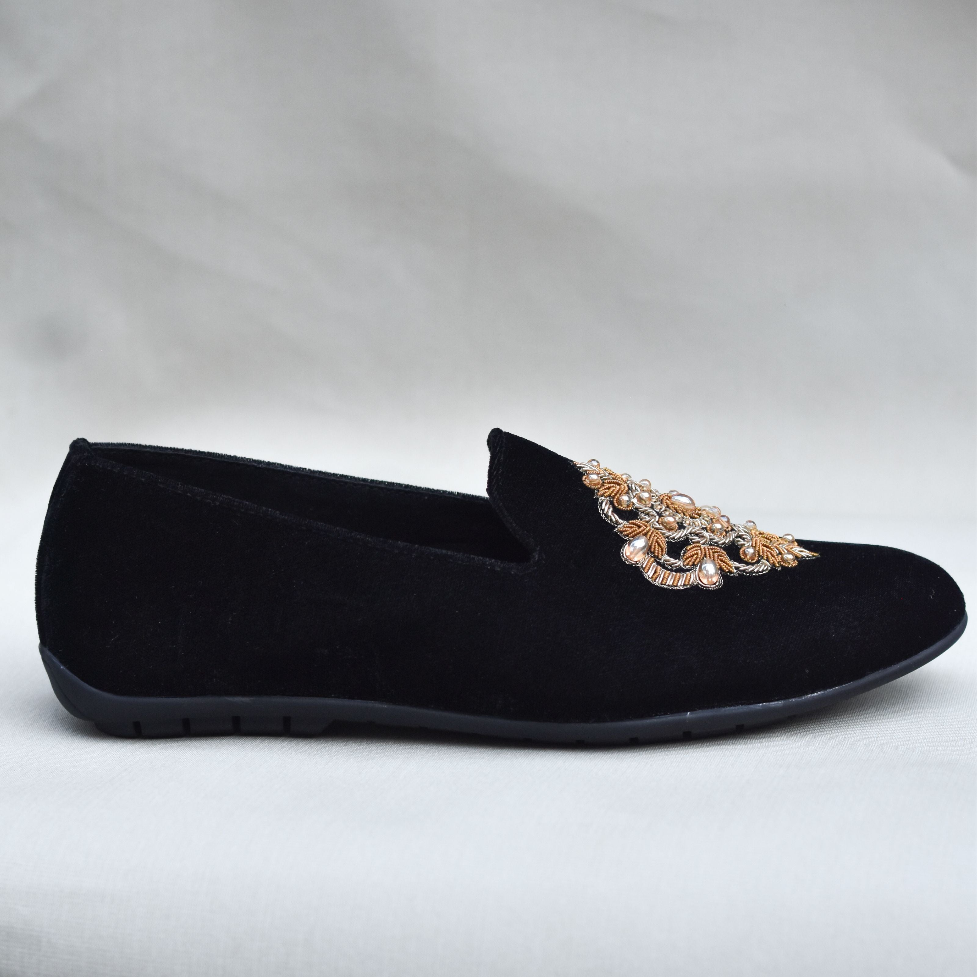 Handcrafted men's ethnic loafers with gold stone detailing and zardozi work, ideal for dancing at sangeet celebrations.