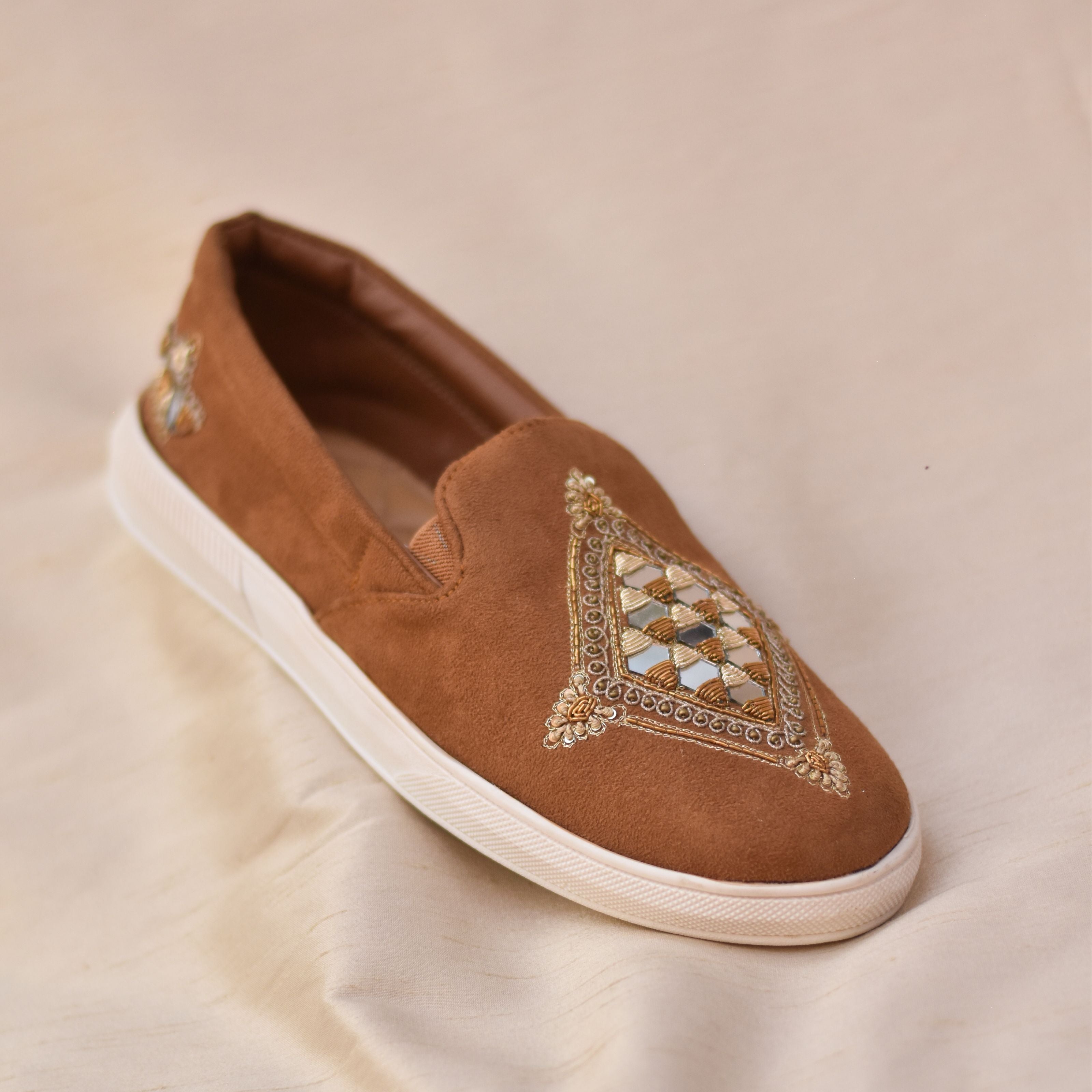 Groom's tan sneakers featuring mirror, zari and threadwork which blends comfort with Indo-Western ethnic style.