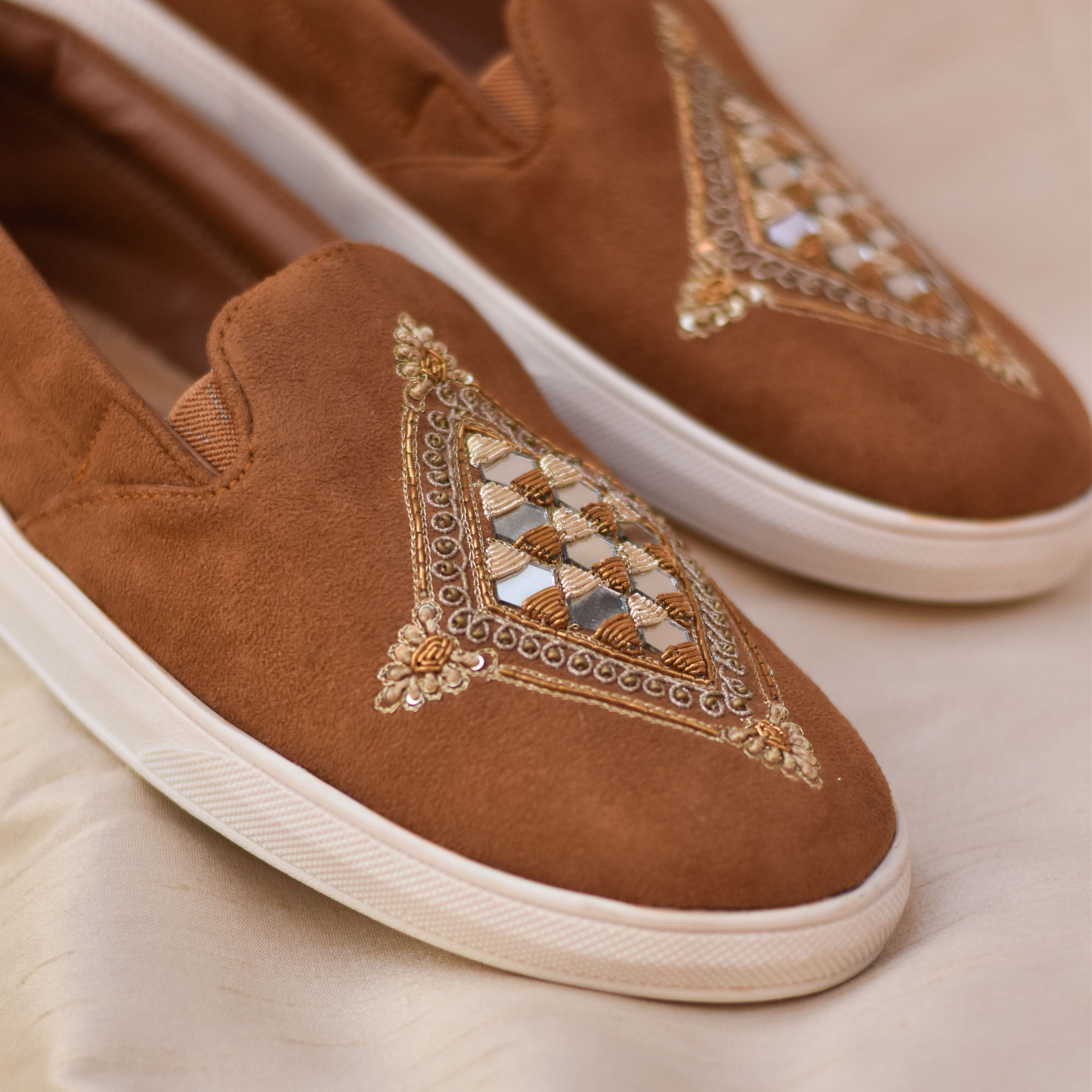 Men’s festive sneakers in tan suede with geometric mirror work which makes it ideal ethnic shoes for weddings and celebrations.