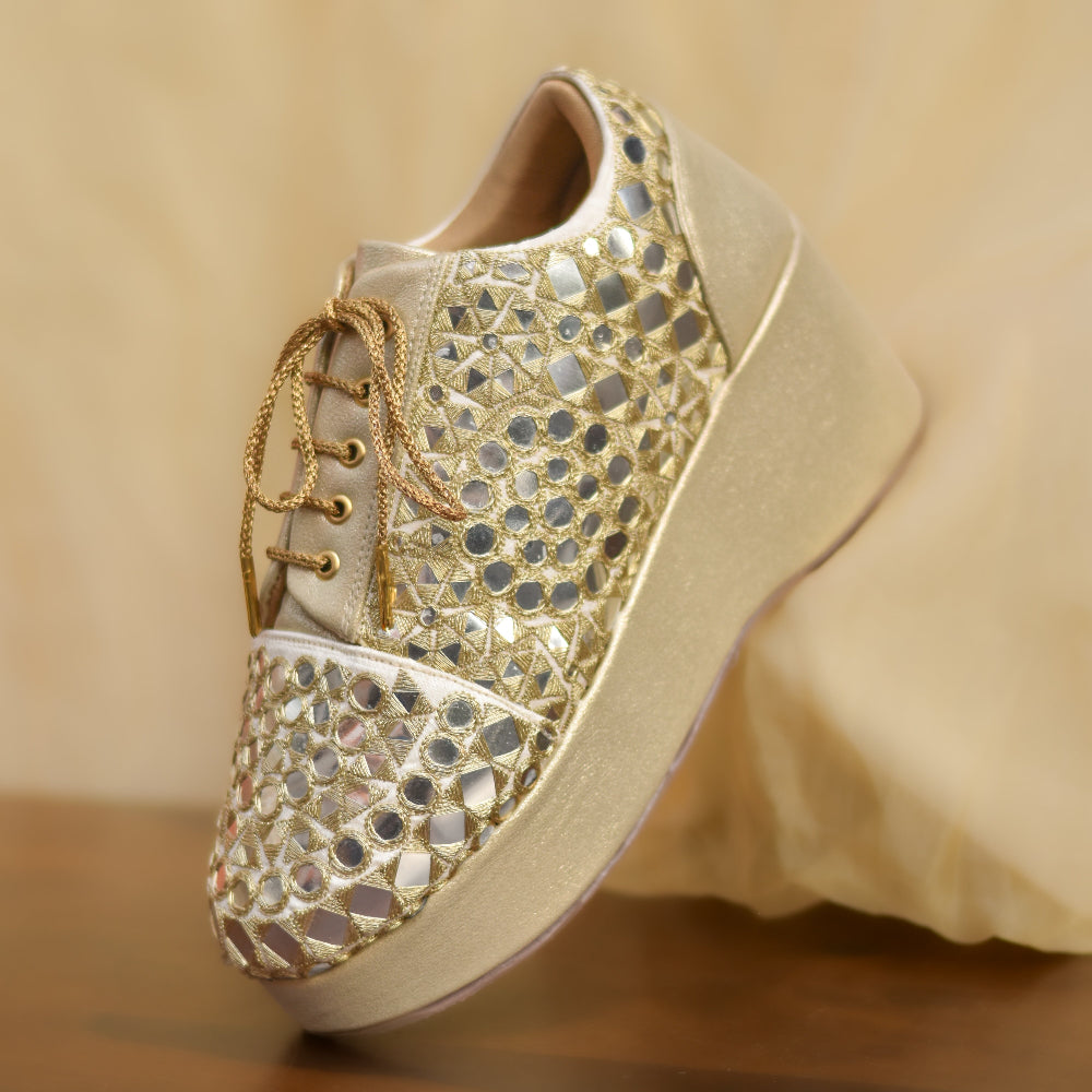 Metallic gold lace up wedge shoes with handcrafted mirror accents and elevated sole
