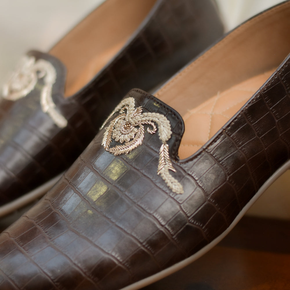 Chocolate brown loafers with patent texture and contrast thread embroidery