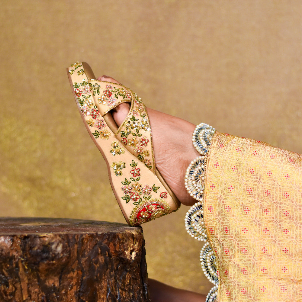 Elegant golden wedges for women with intricate hand-embroidered floral embellishments