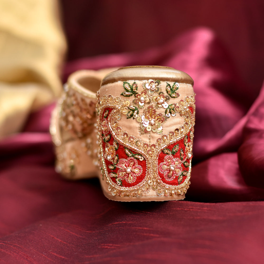 Decorative heels with intricate gold and red embroidery with Indian paisely motif applique 