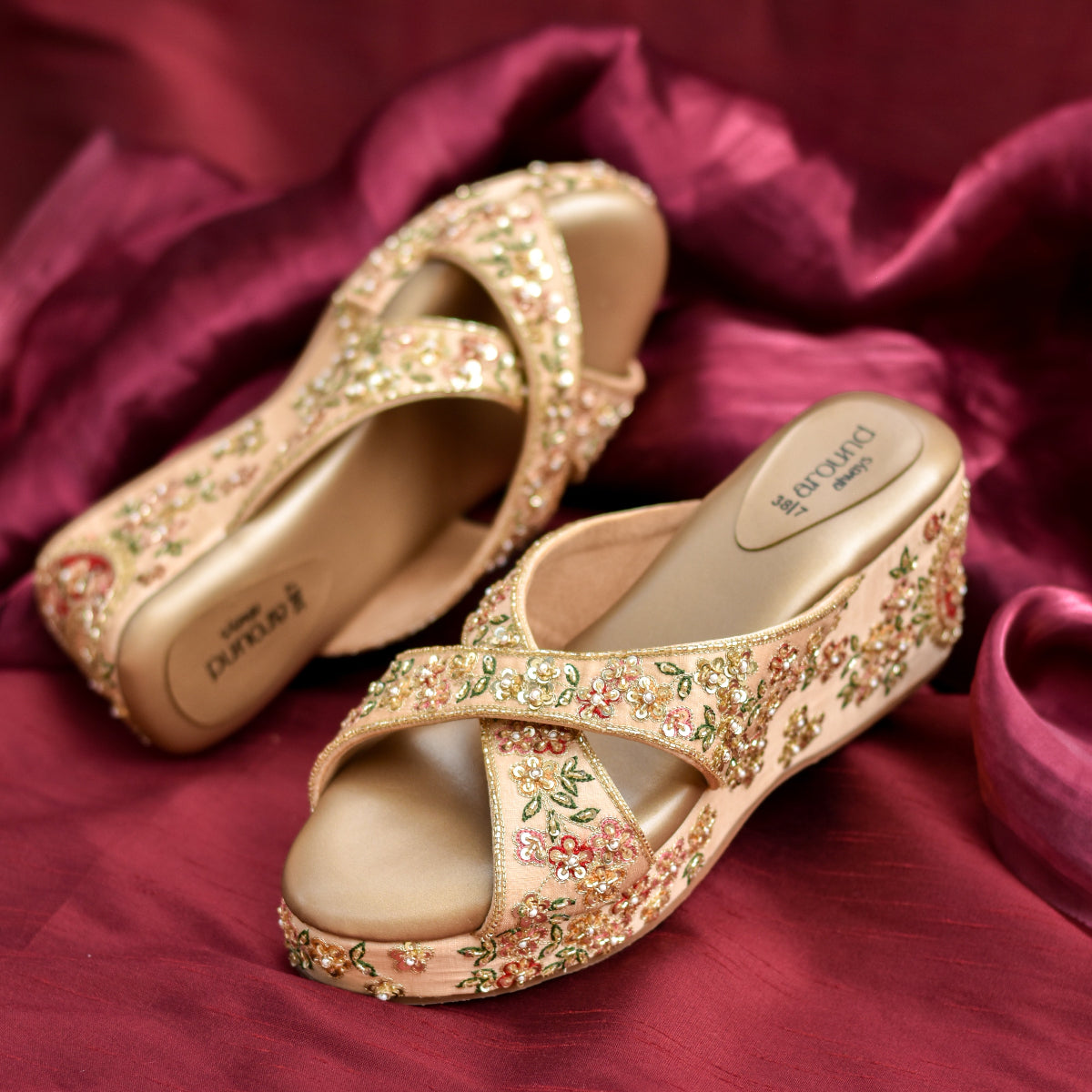 Versatile golden embroidered wedge heels with floral sequin detailing and cross strap