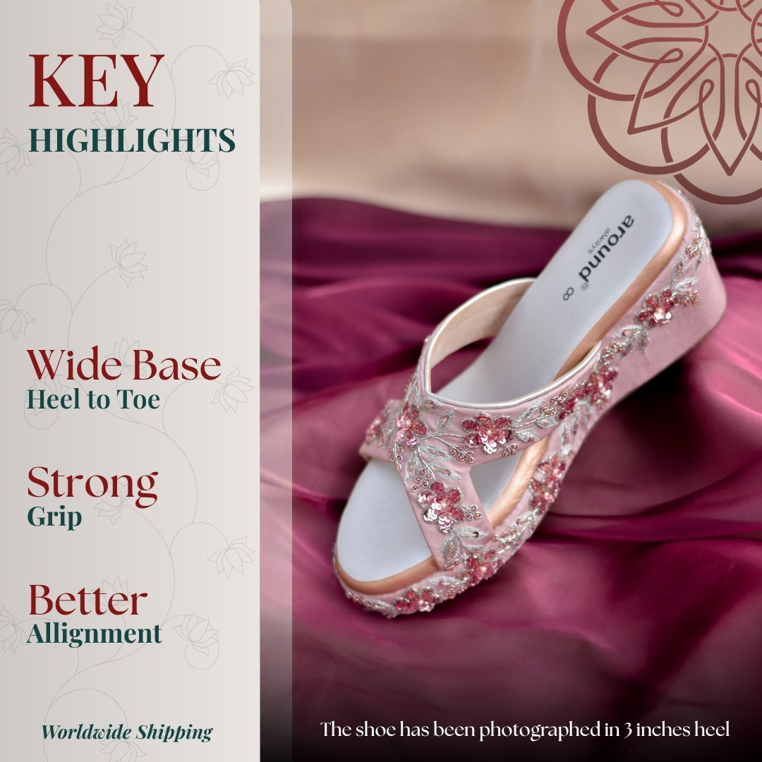 Blush pink embroidered wedge sandal with floral detailing and supportive wide base