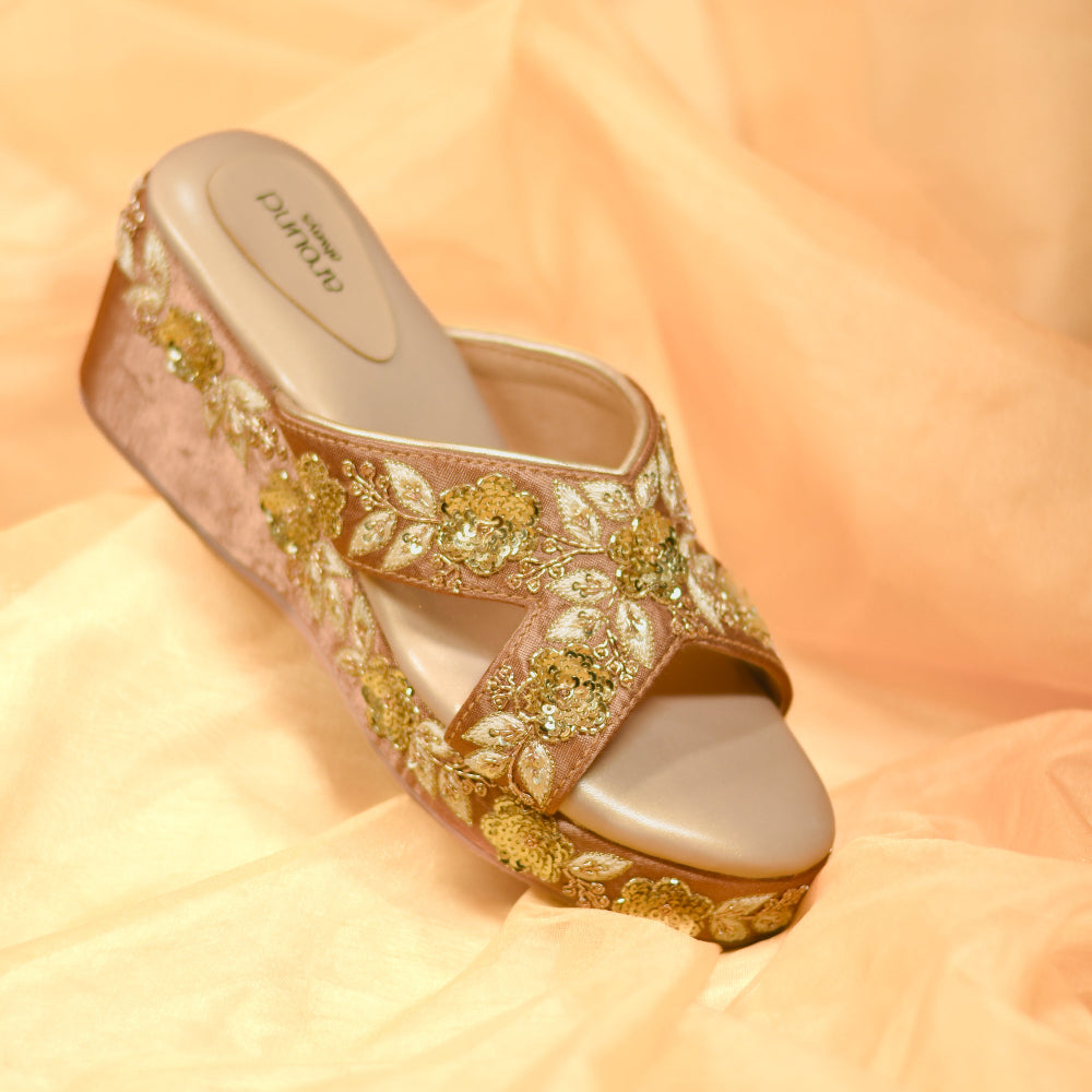 Festive wedge heels in champagne tone with handcrafted floral patterns
