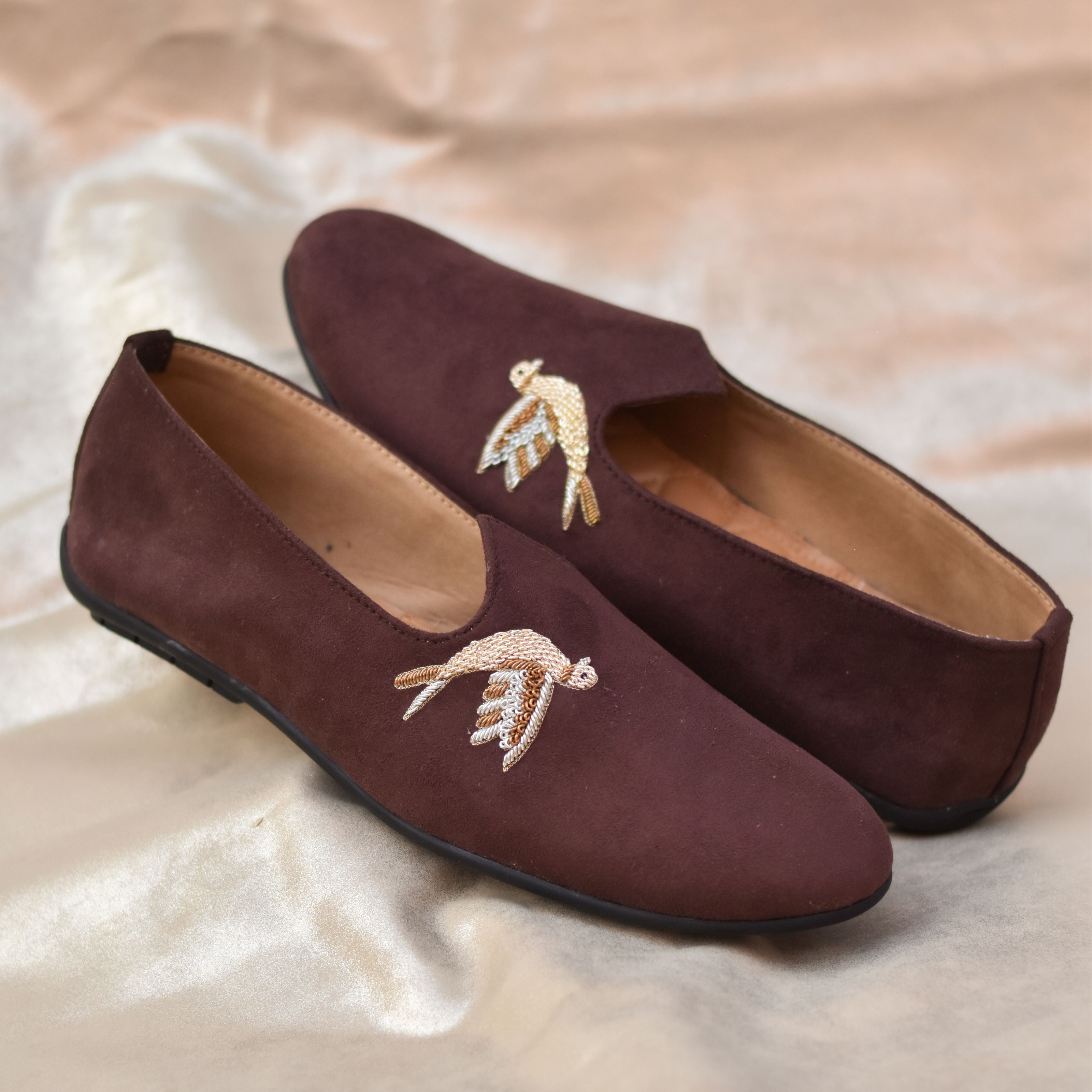 Brown suede ethnic loafers for men with gold bird embroidery for understated luxury in weddings and festive events.