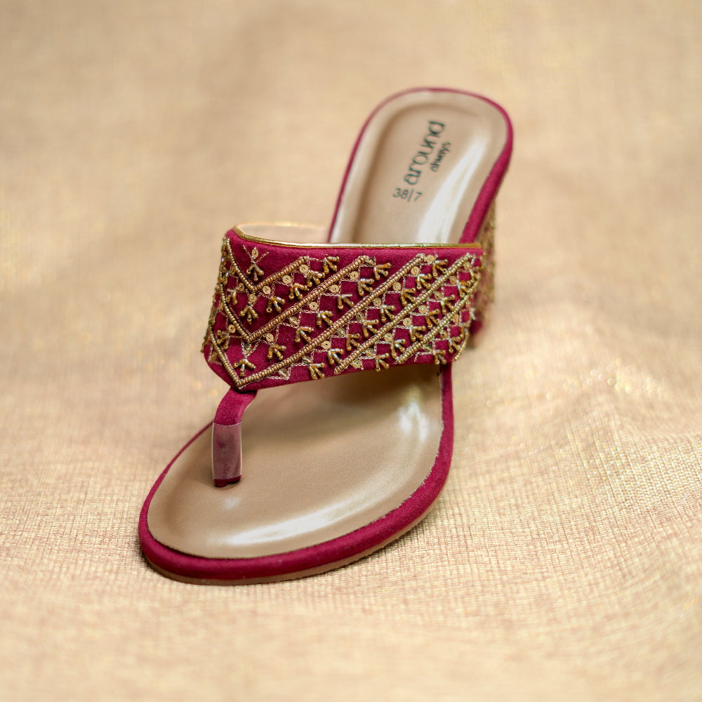 Traditional maroon heels with detailed geometric embroidery and comfortable sole
