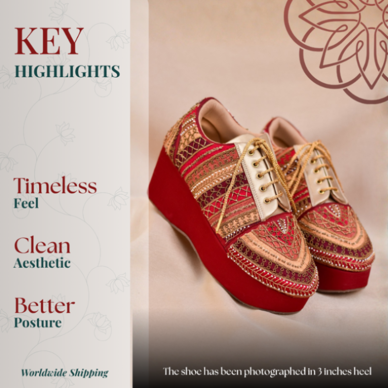 Red wedge sneaker with intricate gold embroidery, lace up front, and cushioned sole for balanced comfort