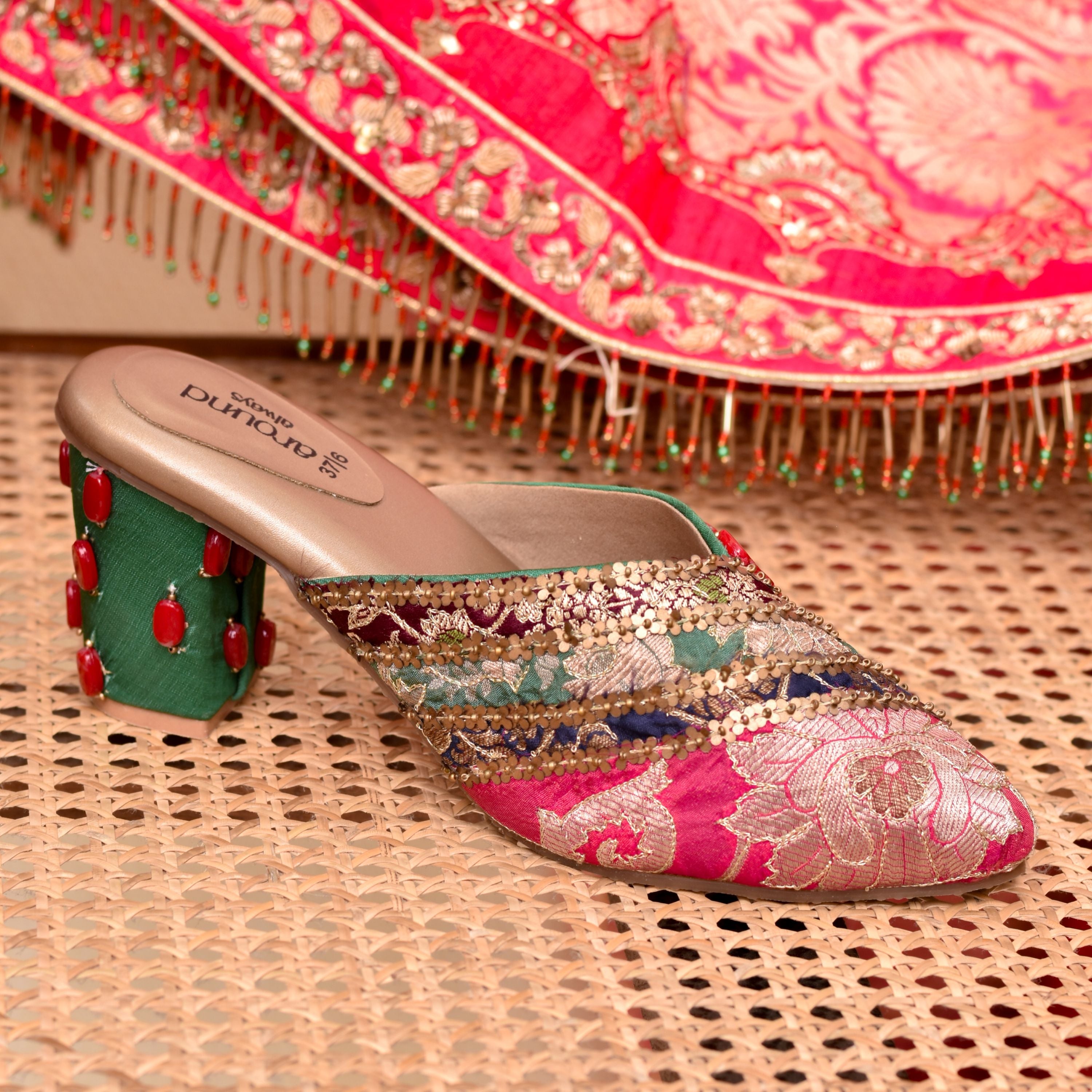 Women’s traditional mules with green fabric and red stone
