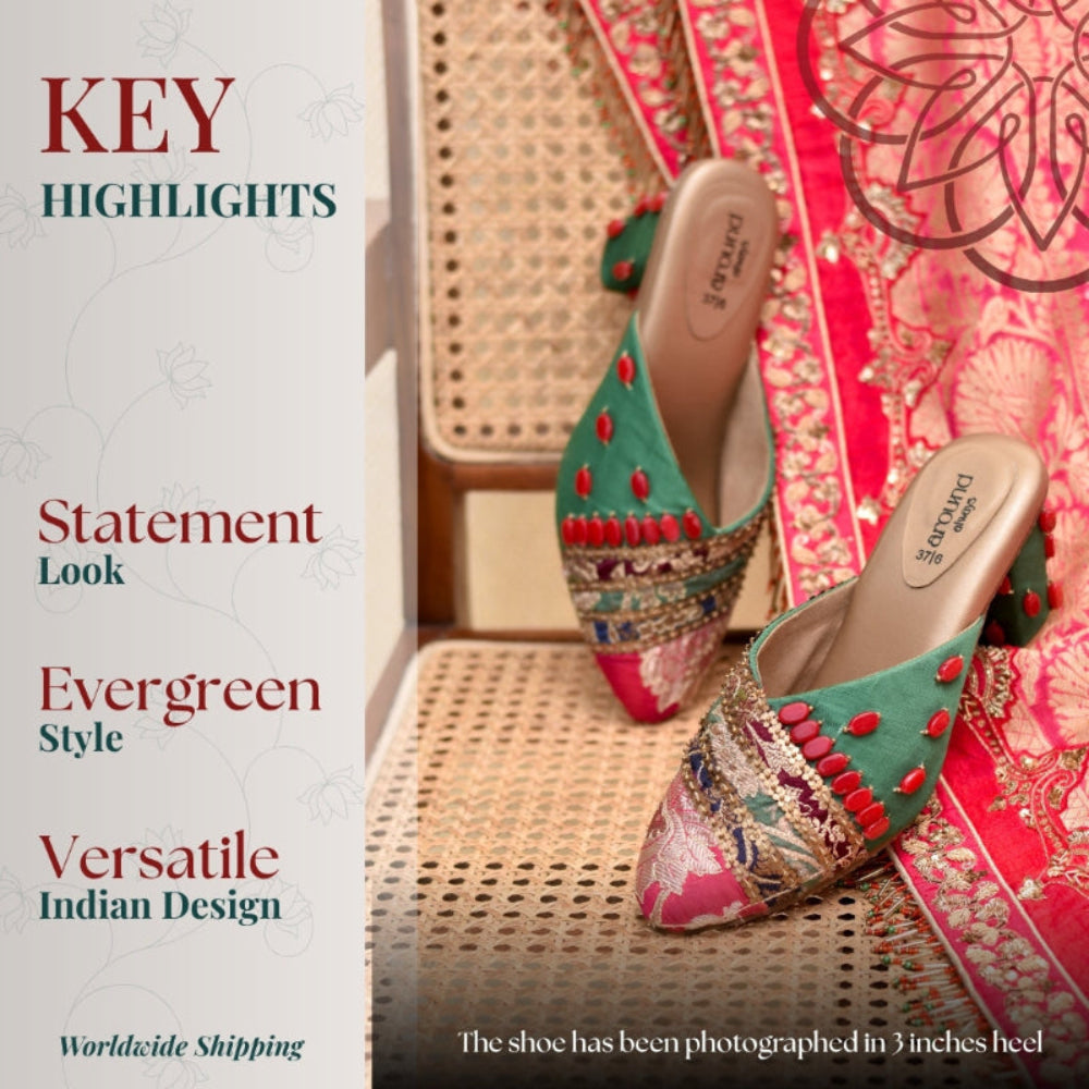 Traditional block heel with ornate threadwork and bead embellishments styled against festive fabric backdrop