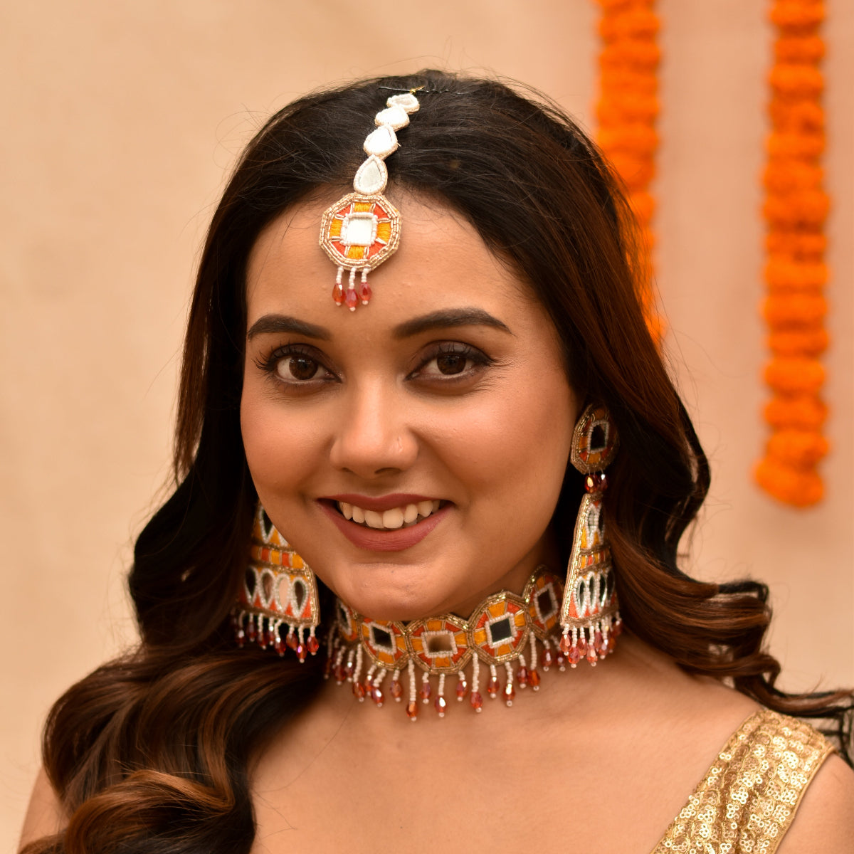 Indian woman looking beautifully in a beaded haldi jewellery set 
