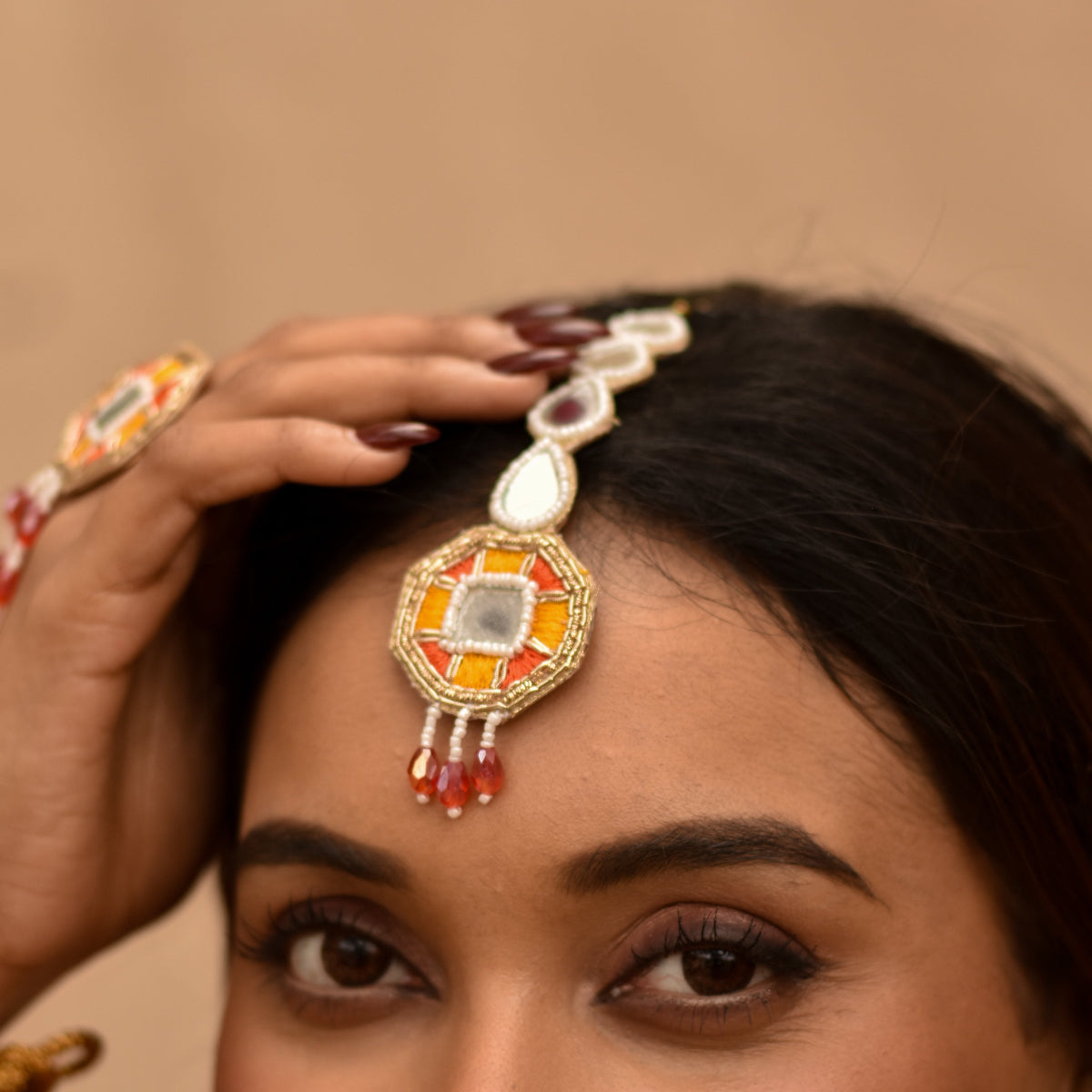 Maangtika head accessory for Indian bride to wear during haldi and mehendi ceremony