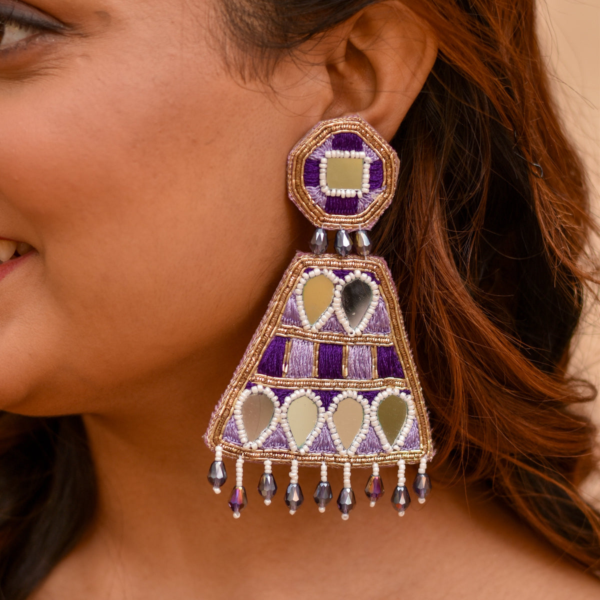 Long decorative earrings with mirror and purple thread work for carnival and haldi ceremonies