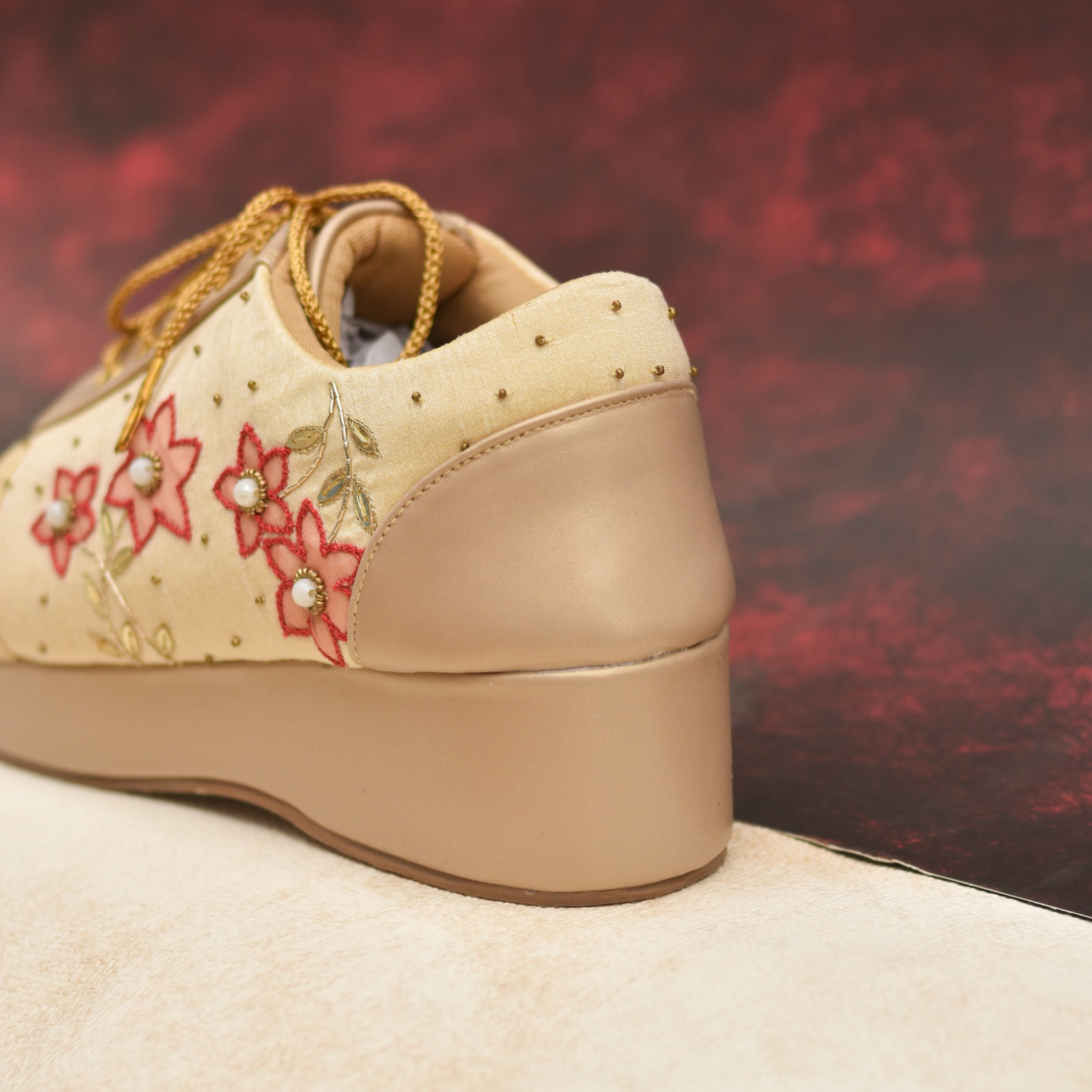 Comfortable beige platform sneakers with festive flower design.