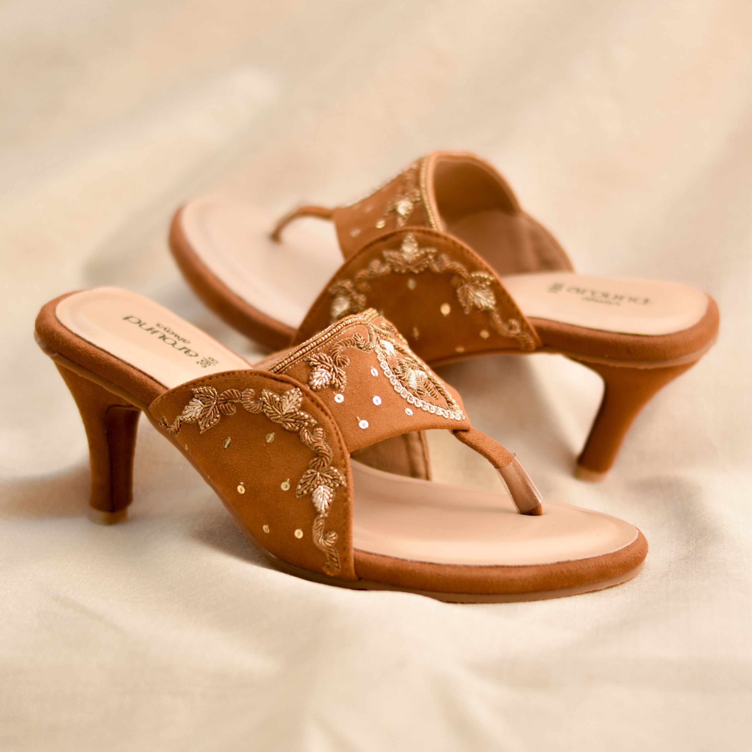 Tan brown suede heeled sandals with gold sequin detailing.
