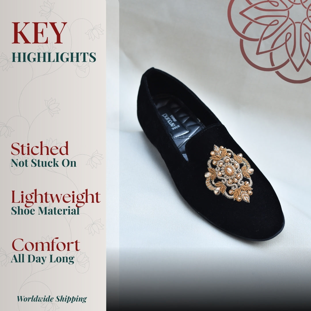 Black velvet loafers with ornate gold embroidery