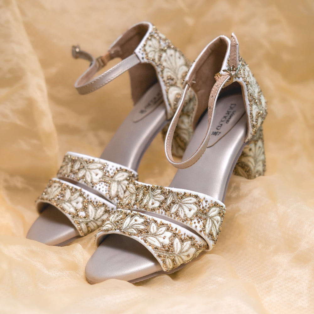 Gold and ivory wedding sandals with broad decorative straps
