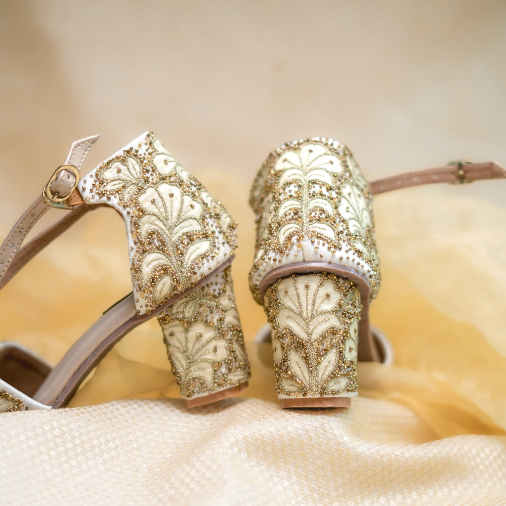 Ivory wedding sandals with floral textile work and ankle strap

