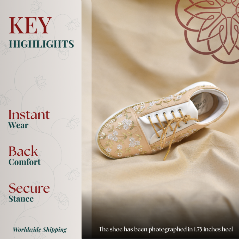 Beige embroidered sneaker wedges with floral detailing and cushioned comfort