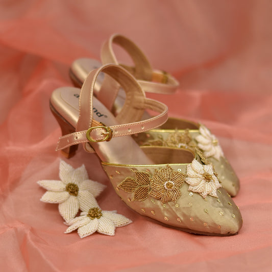 Golden sandals with stylish slim heels