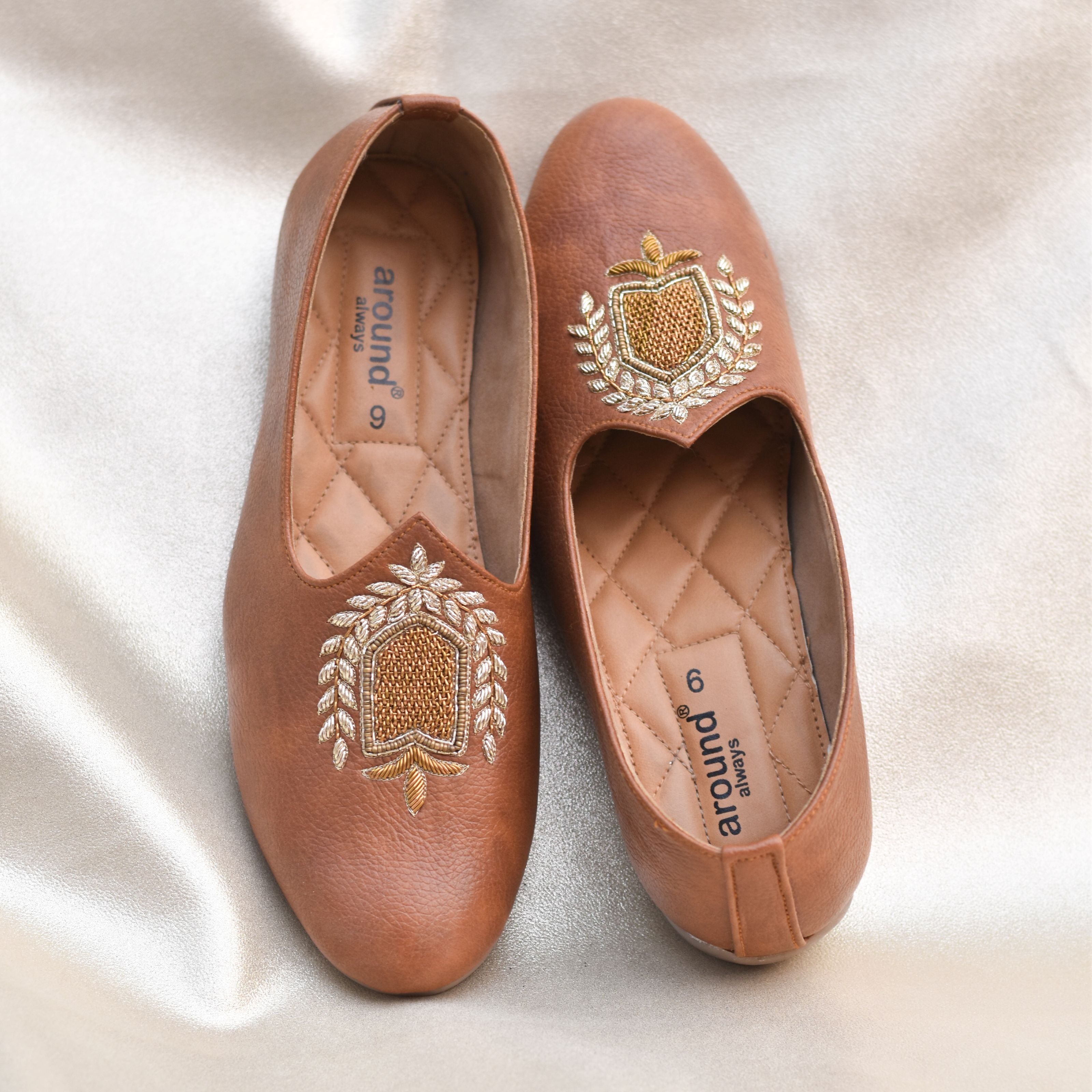Tan ethnic mojris for men with gold zardozi embroidery or weddings and formal occasions.
