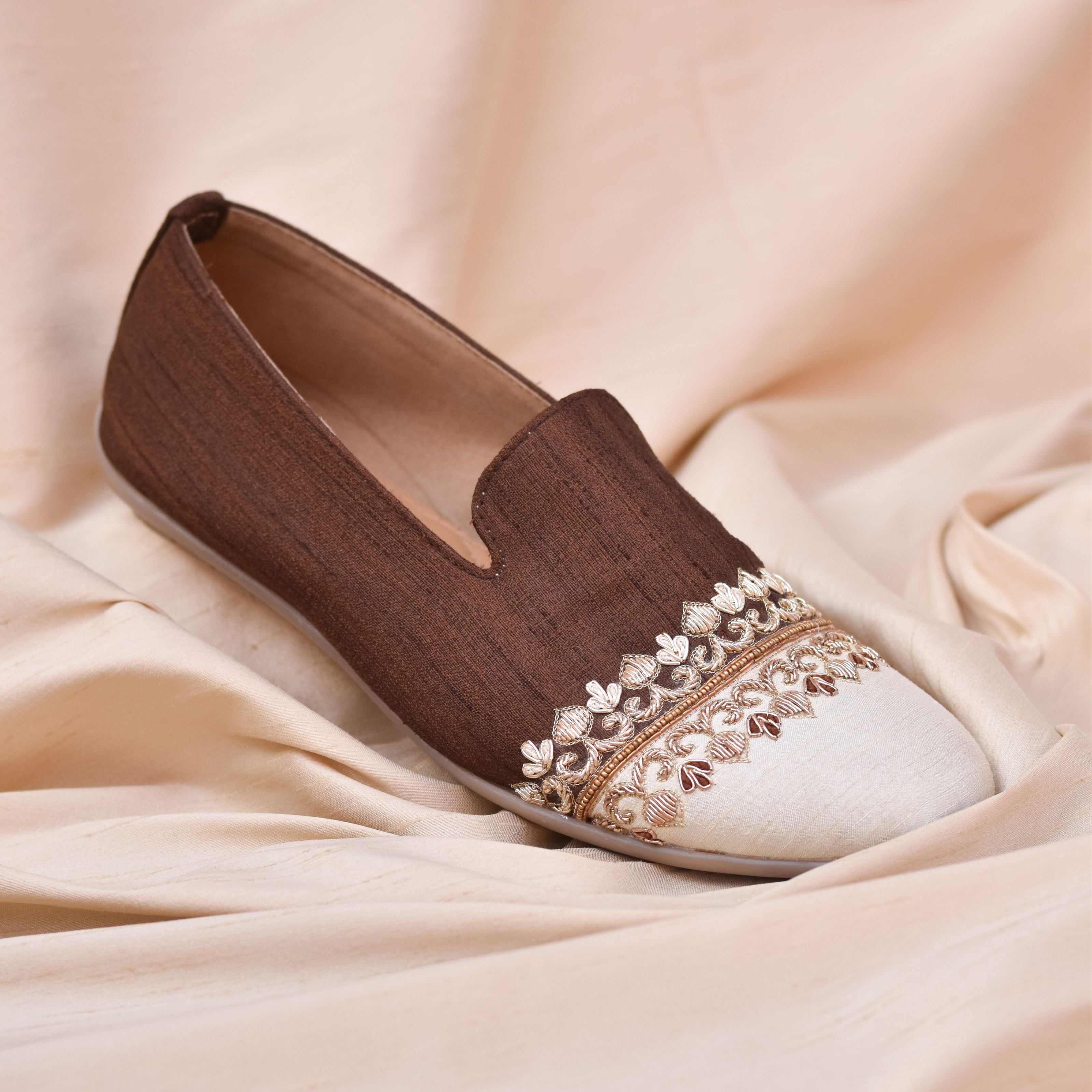 Dark brown and off-white ethnic loafers for men with gold embroidery for wedding and festive occasions.