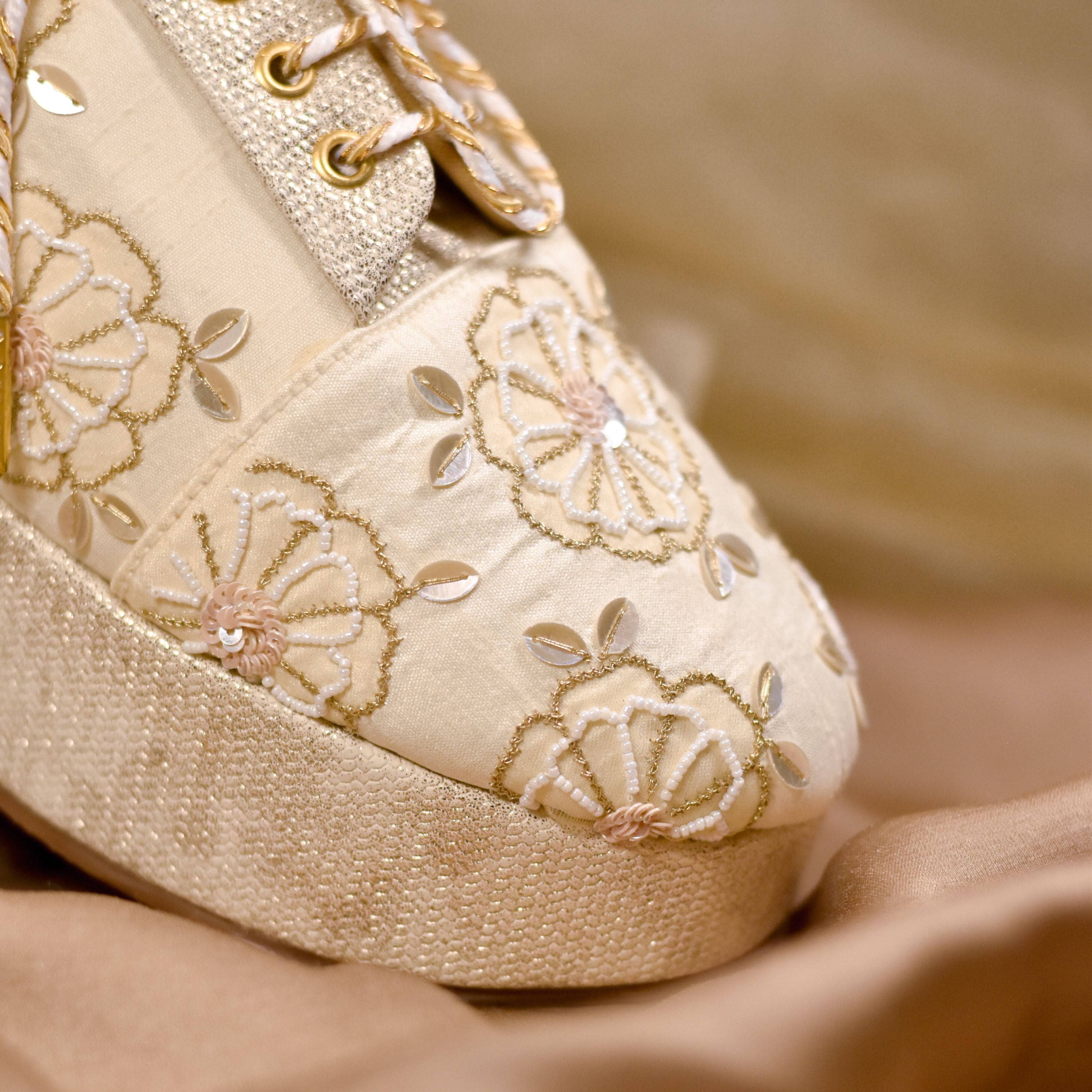 Party-ready bridal sneakers with gold stitching, leaf sequins