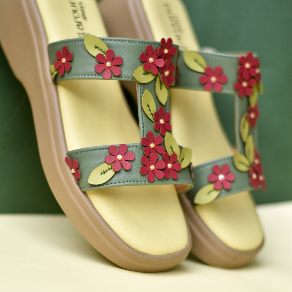 Floral platform sandal with layered blossoms and leaf detailing