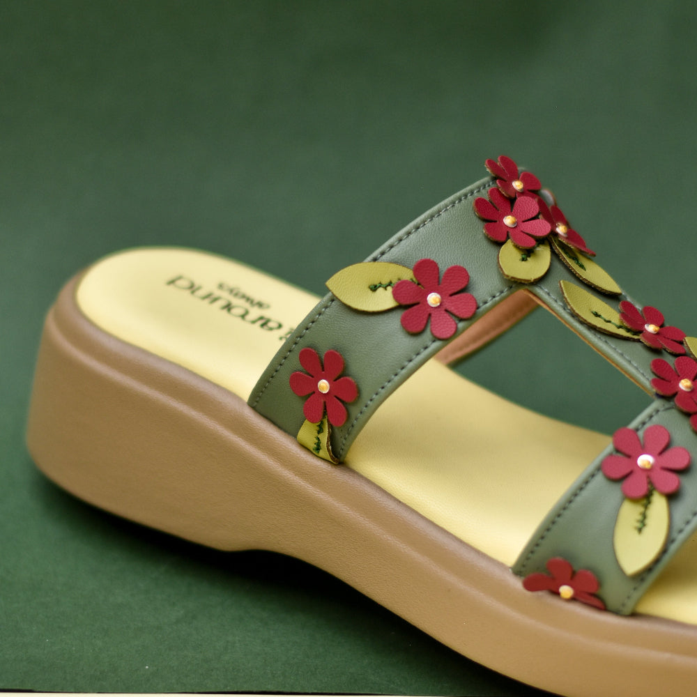 Everyday platform slide with botanical-inspired handcrafted detailing