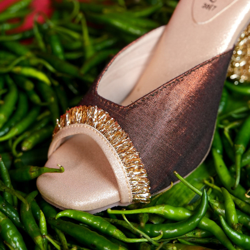 Chocolate brown festive mule with champagne base and gold trim
