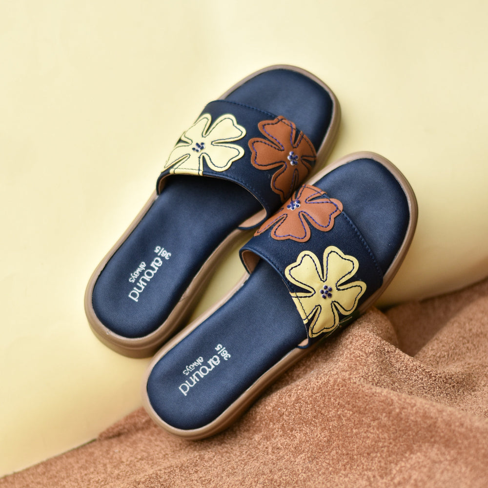 Navy slide sandal with oversized multicolour floral appliqués