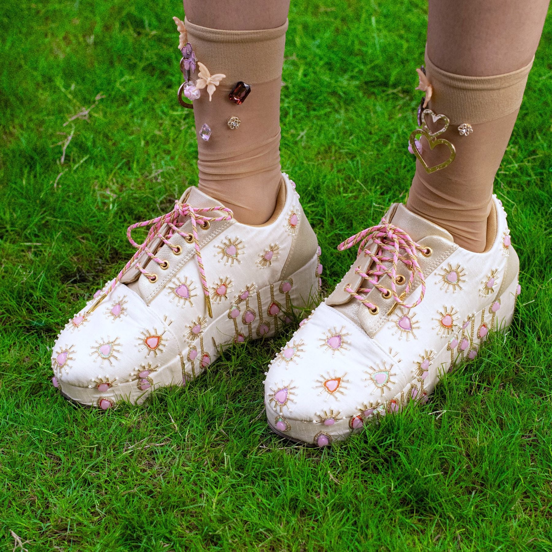 Quirky lace-up sneakers with beadwork and playful design