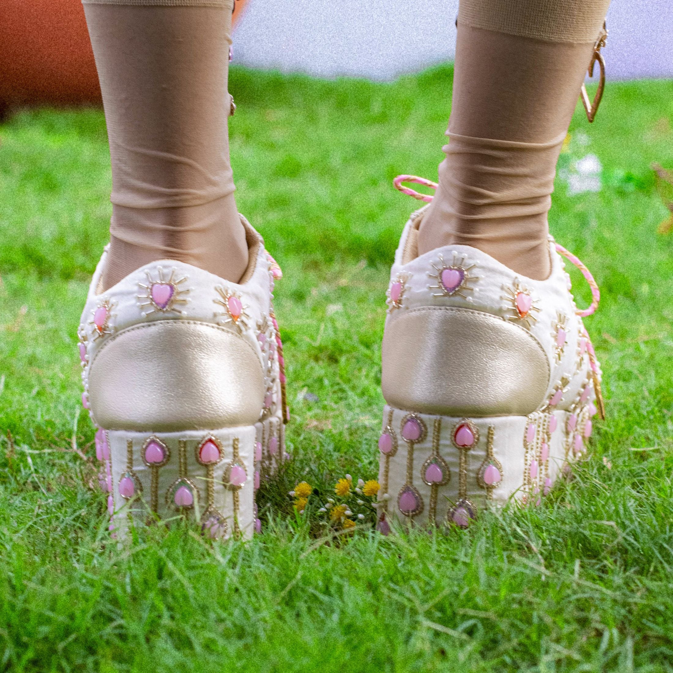 Decorative shoes with pink embellishments and cushioned insole
