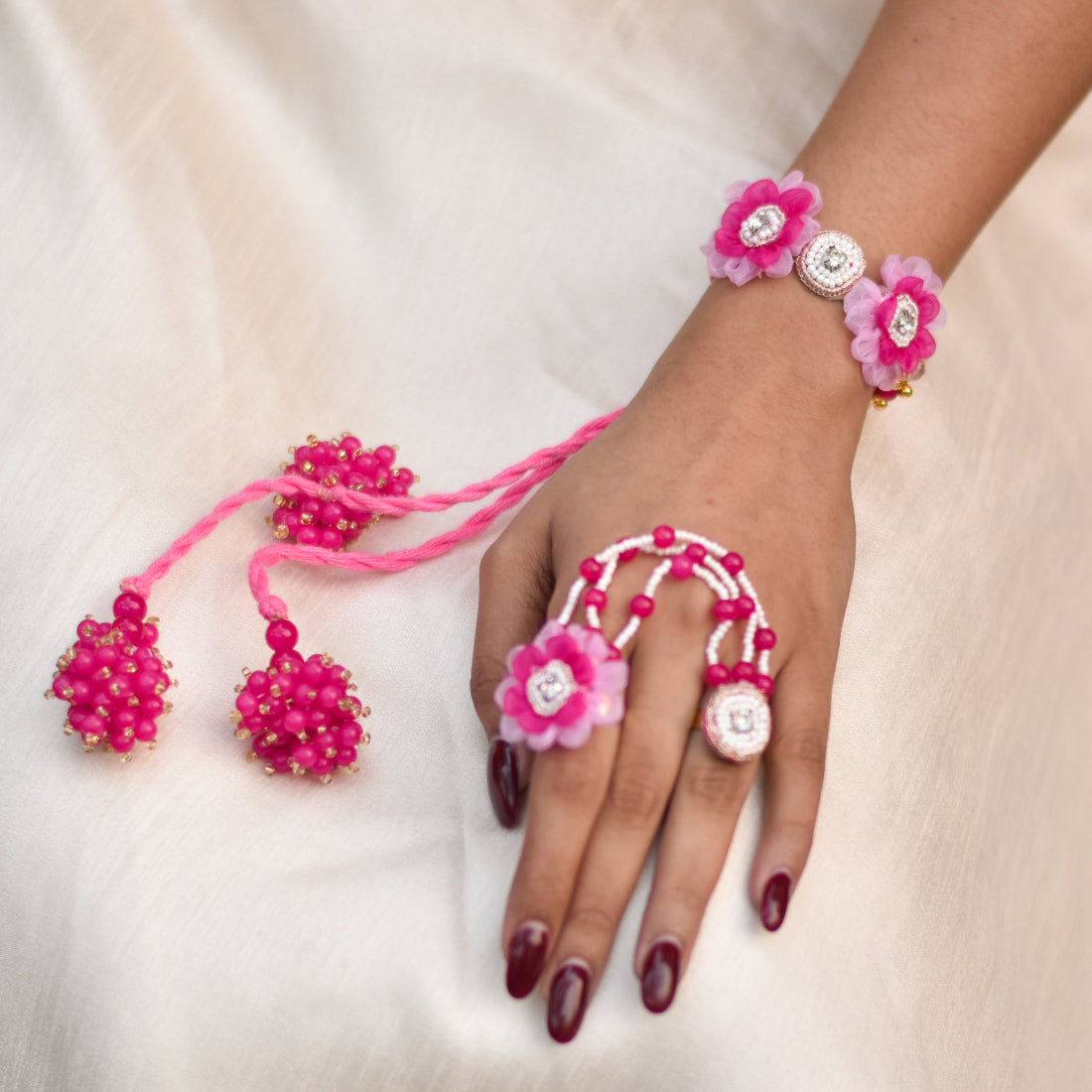 Pink rings and hathphool in a modern handmade avatar with matching latkan for a quirky haldi look