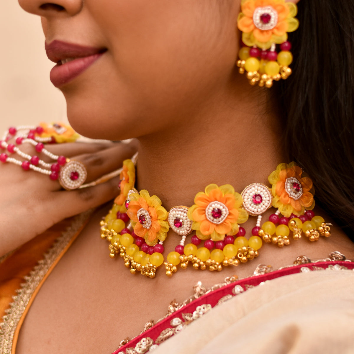 Bright yellow and pink haldi neckpiece with rounded floral designs