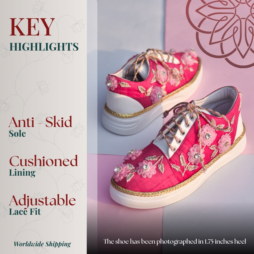 Pink embroidered sneaker with floral appliqué, tie up fastening, and cushioned sole.