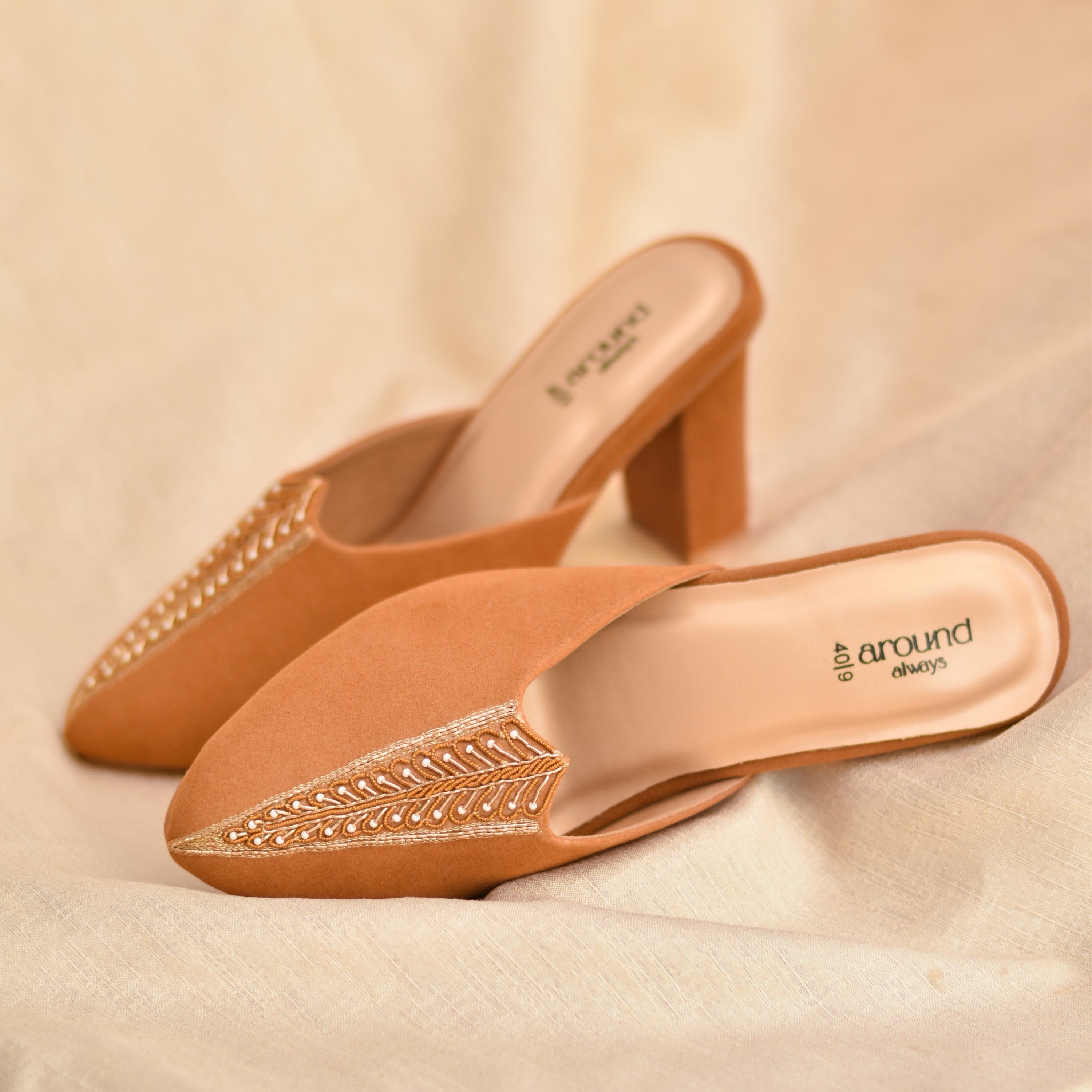 Pair of tan mules with zardozi details on a premium suede base fabric 