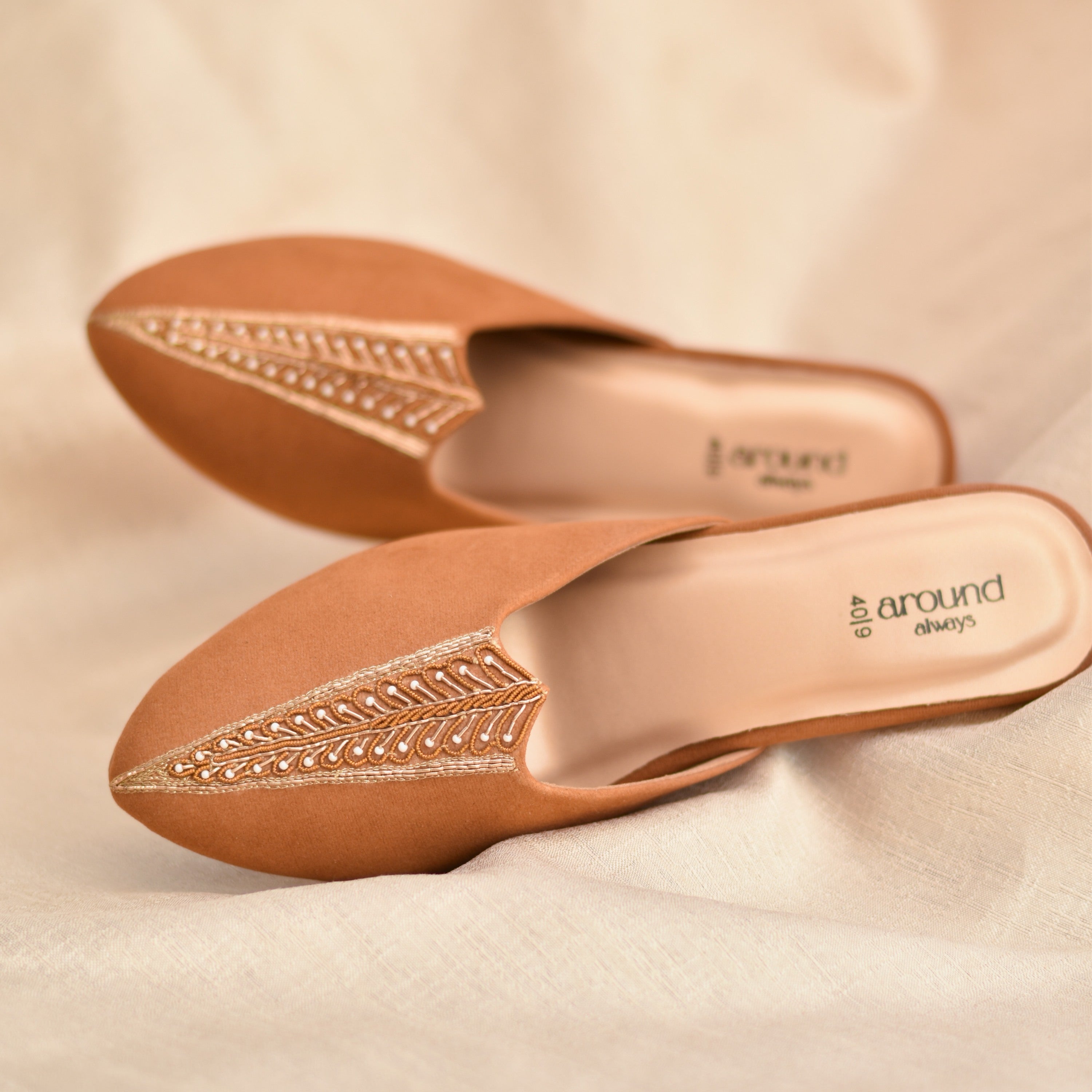 Indian ethnic wear mojri with heels made on a tan suede fabric 