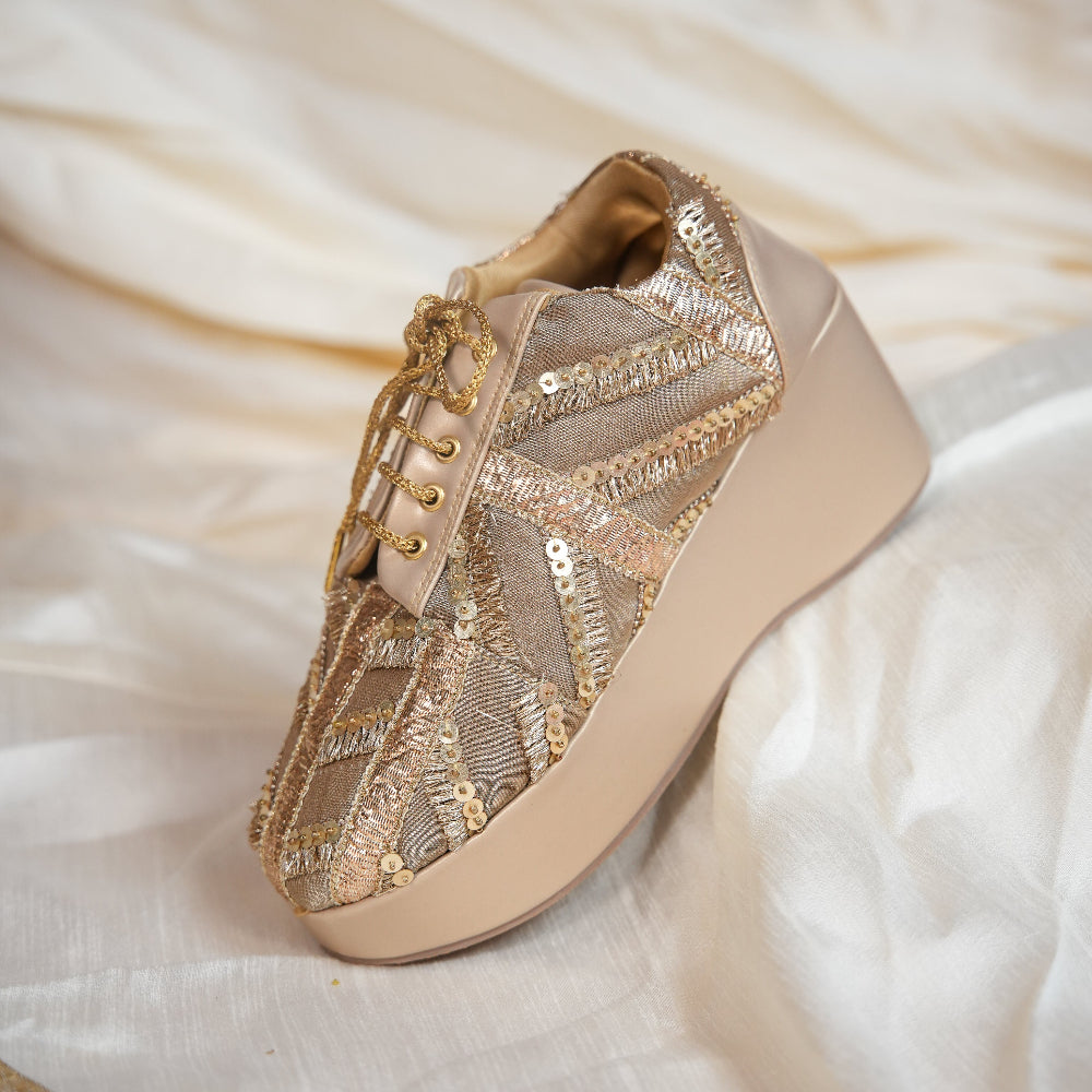 Gold and champagne wedding sneaker with elevated wedge sole
