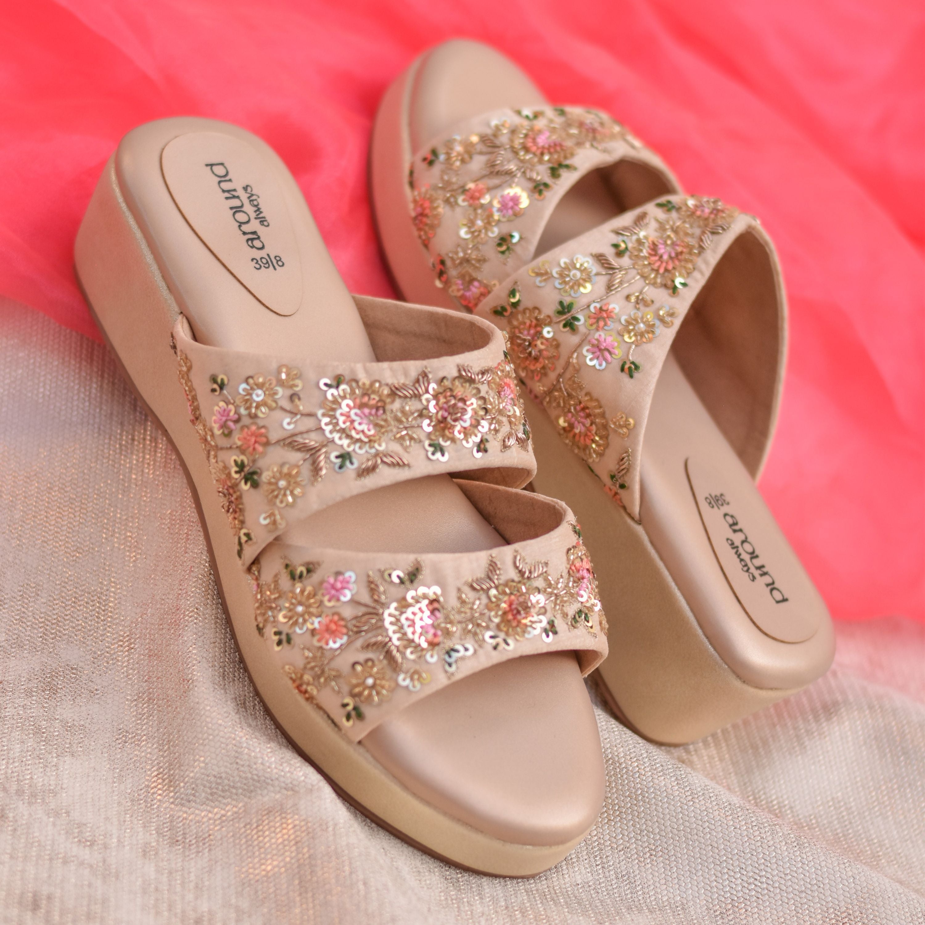 Beige wedge heels with colourful floral motifs and cushioned insole