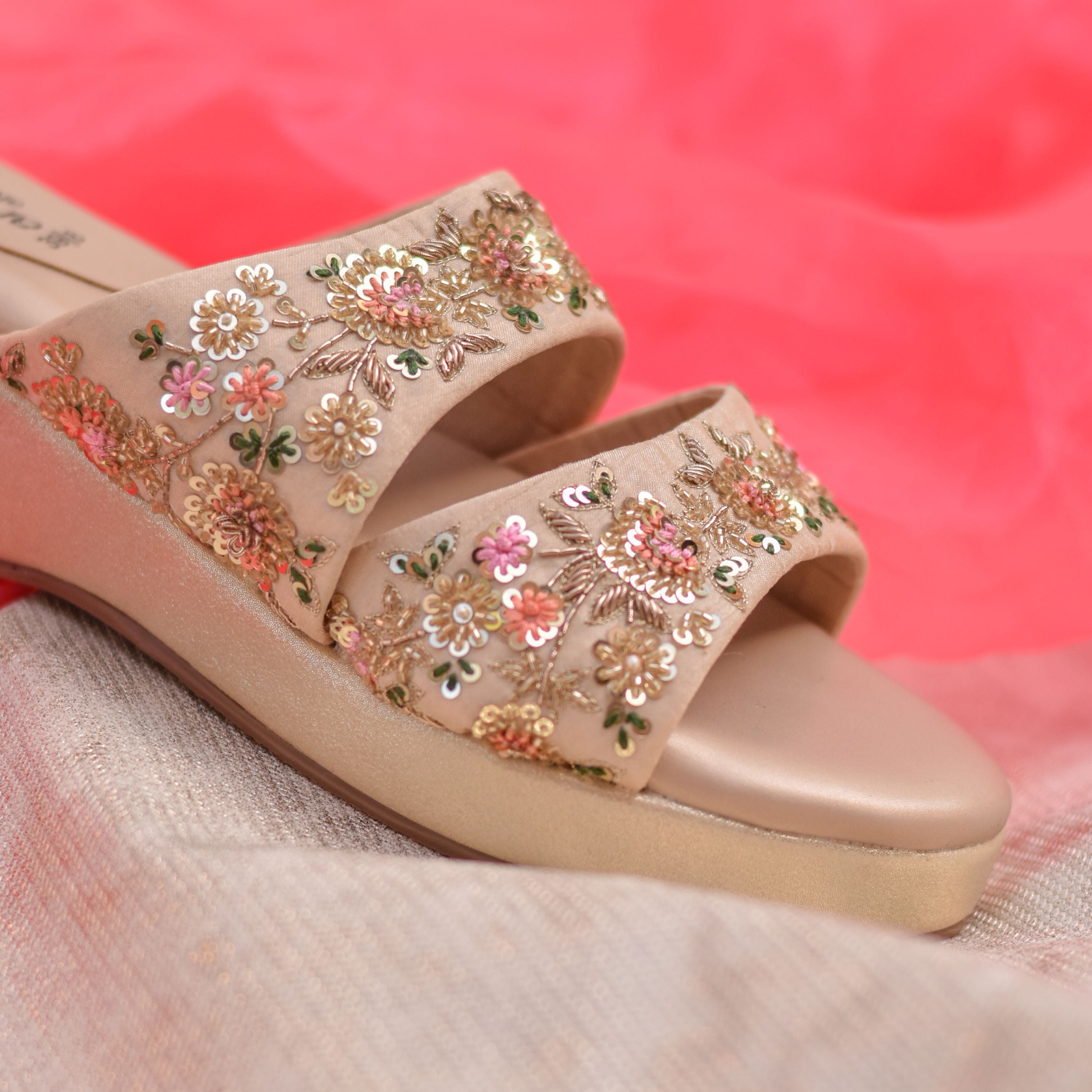 Double-strap festive footwear with sequin and threads. 