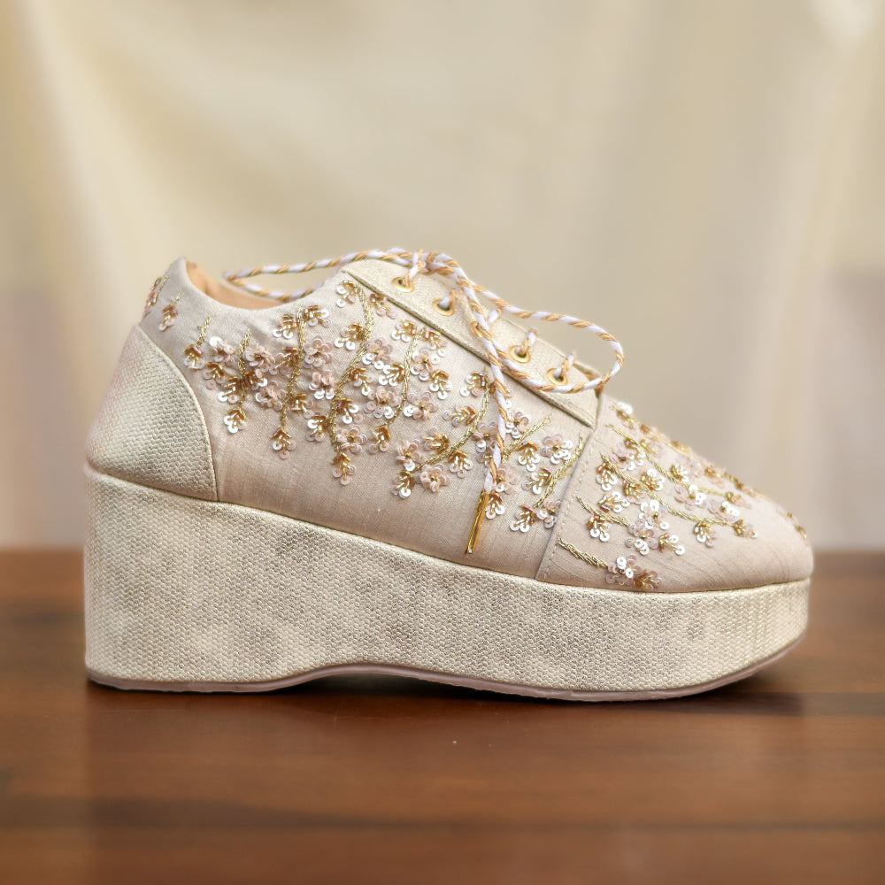 Ivory wedge footwear with sequins embroidery and lace closure