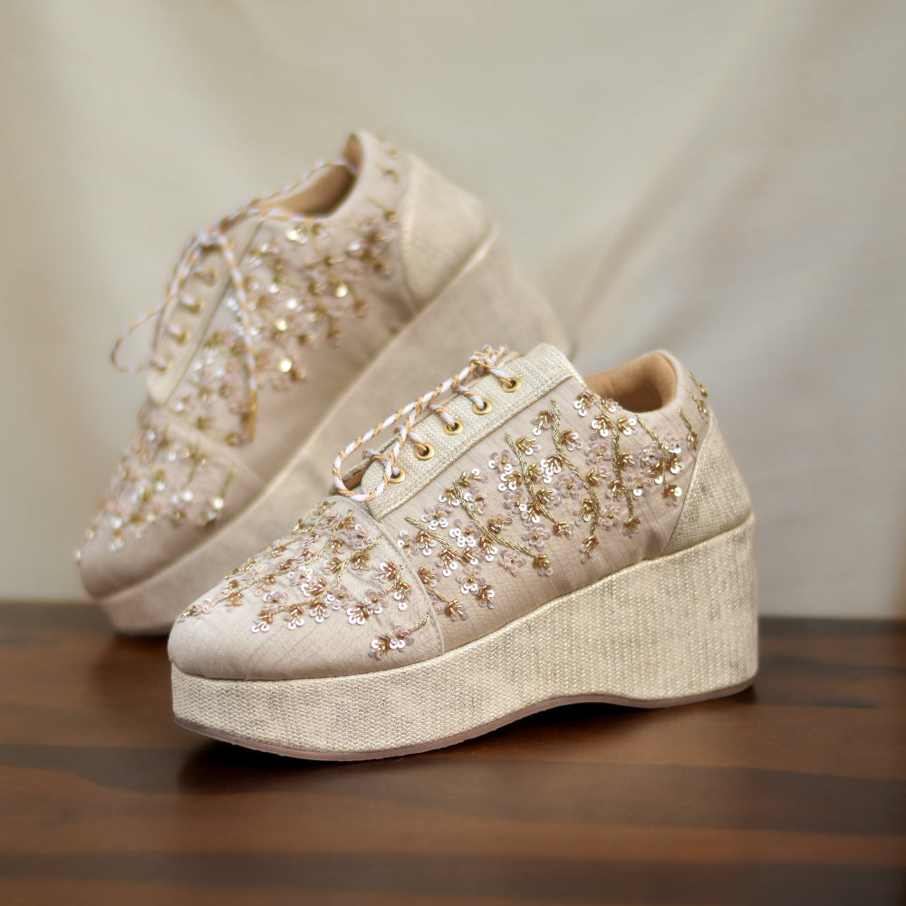 Ivory platform sneaker with floral sequin embellishments