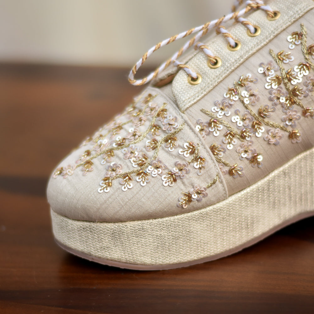 Occasion sneaker with embroidered floral detailing and platform sole