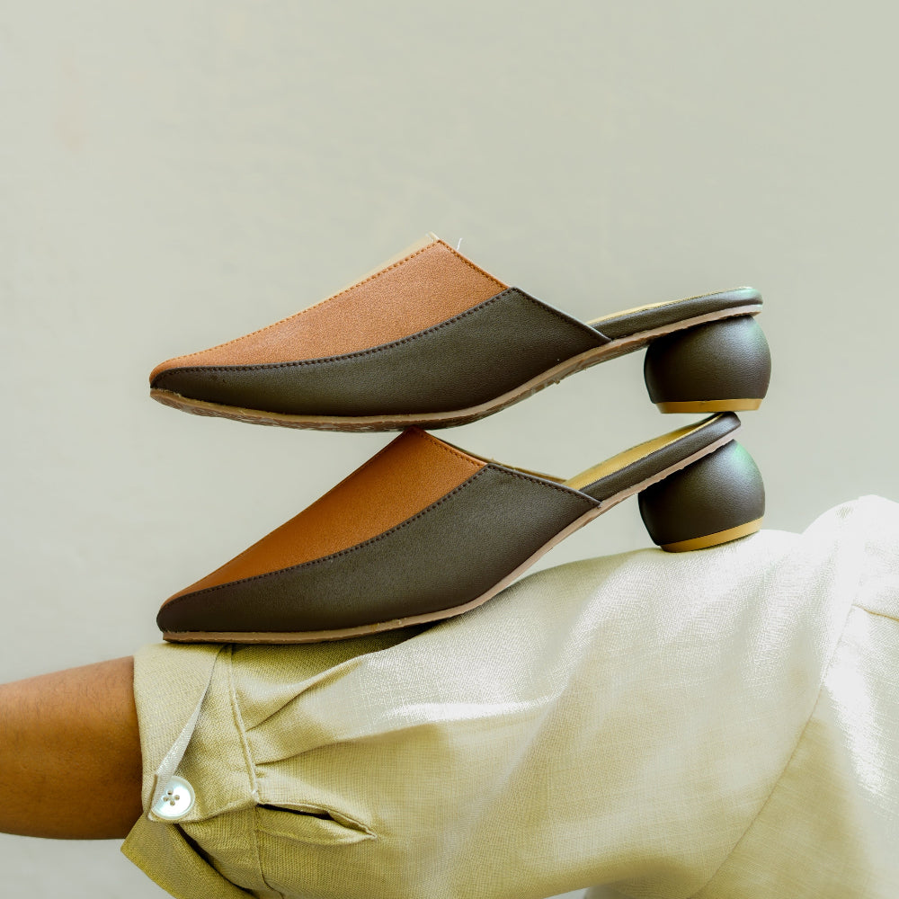 Pointed-toe mule in earthy shades with decorative flower artwork
